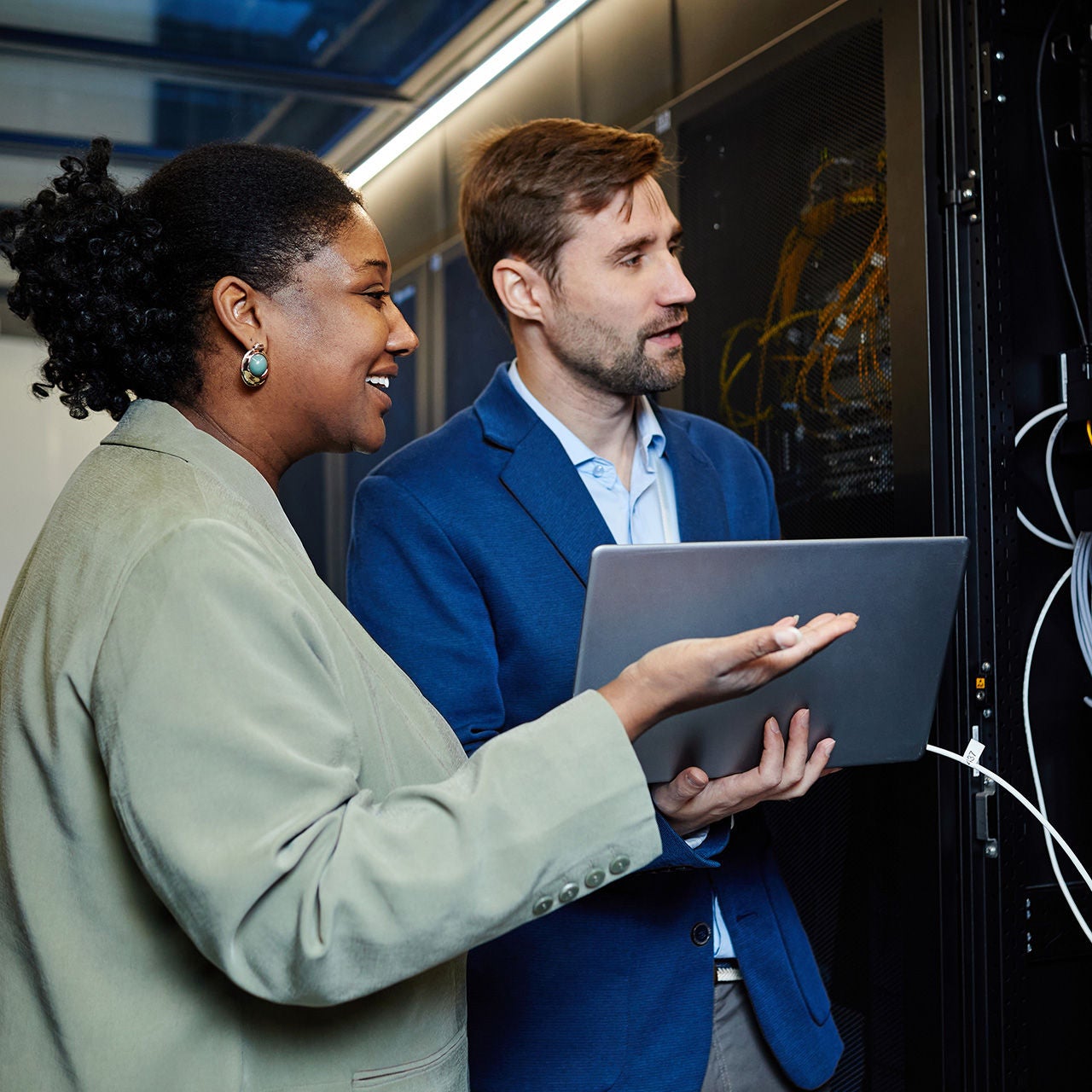 Two network engineers working on a server