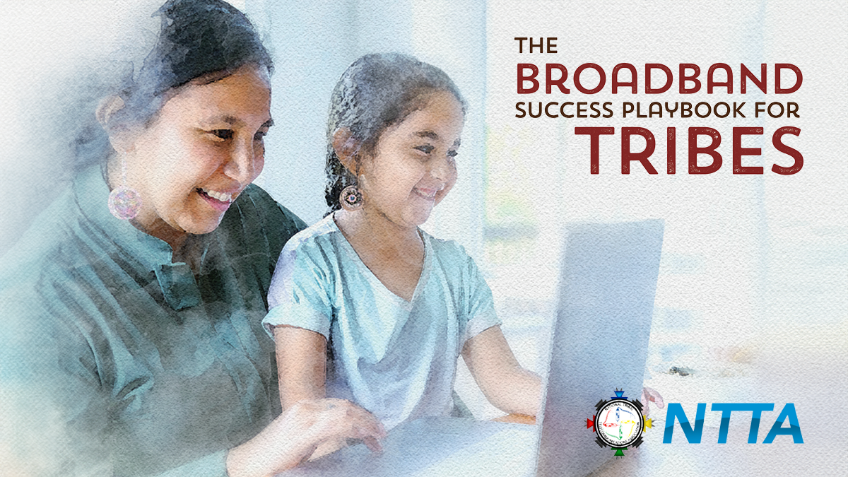 Tribal smiling mother daughter with laptop