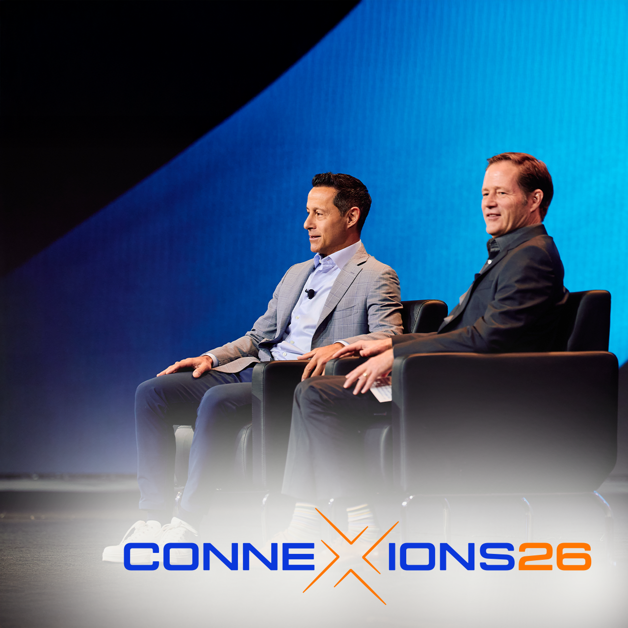 Michael weening and guest on stage at CONNEXIONS26 event