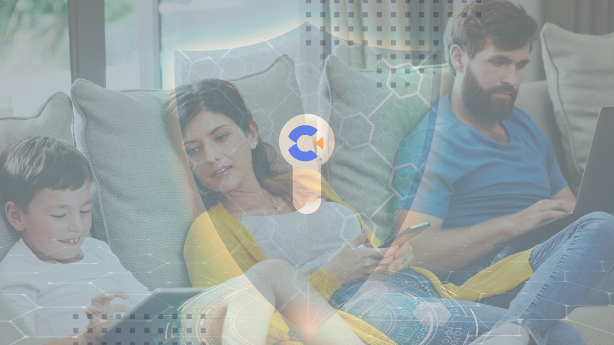 Family with devices on sofa