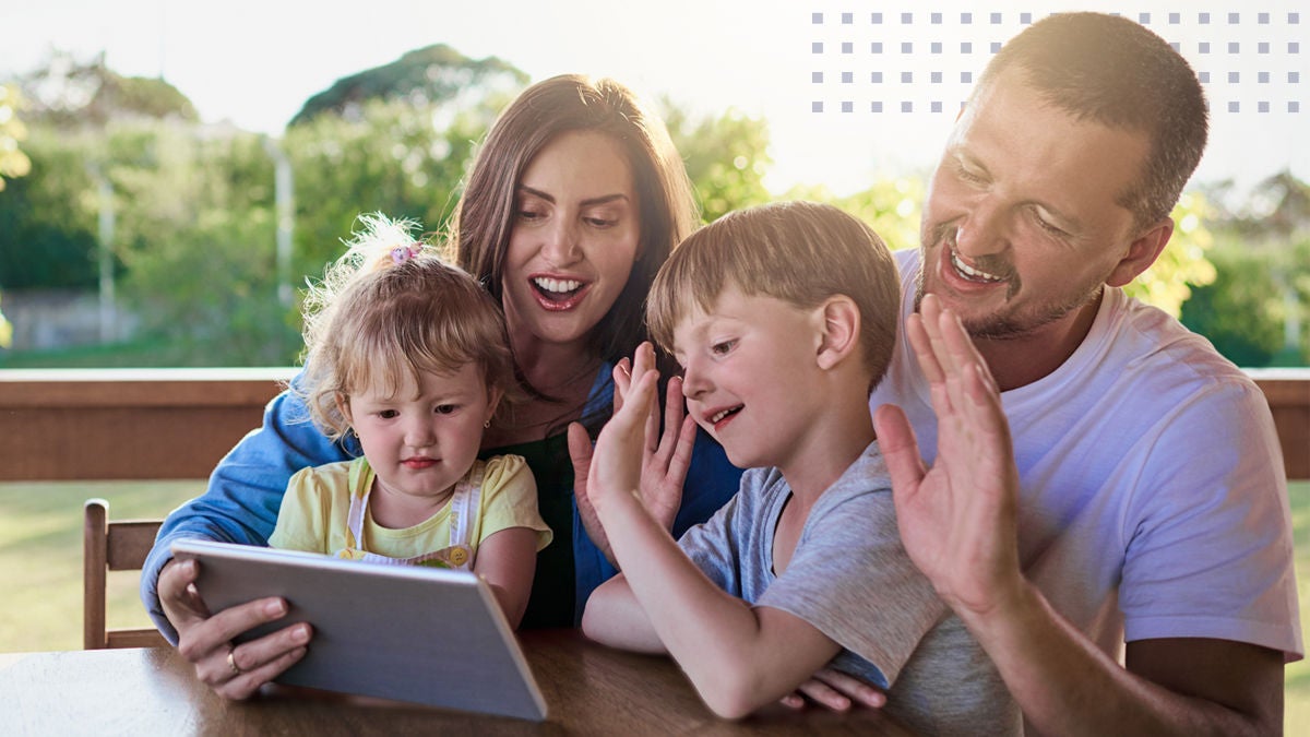 family outside on the tablet making a video call