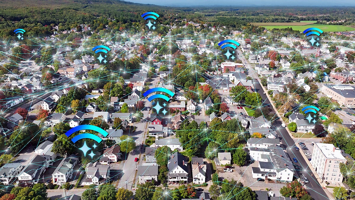 Aerial view of residences with network, wi-fi and AI icons overhead