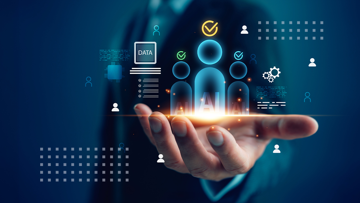 A business professional in a suit holds a glowing holographic interface in the palm of their hand