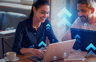 woman and man working together on laptops at cafe