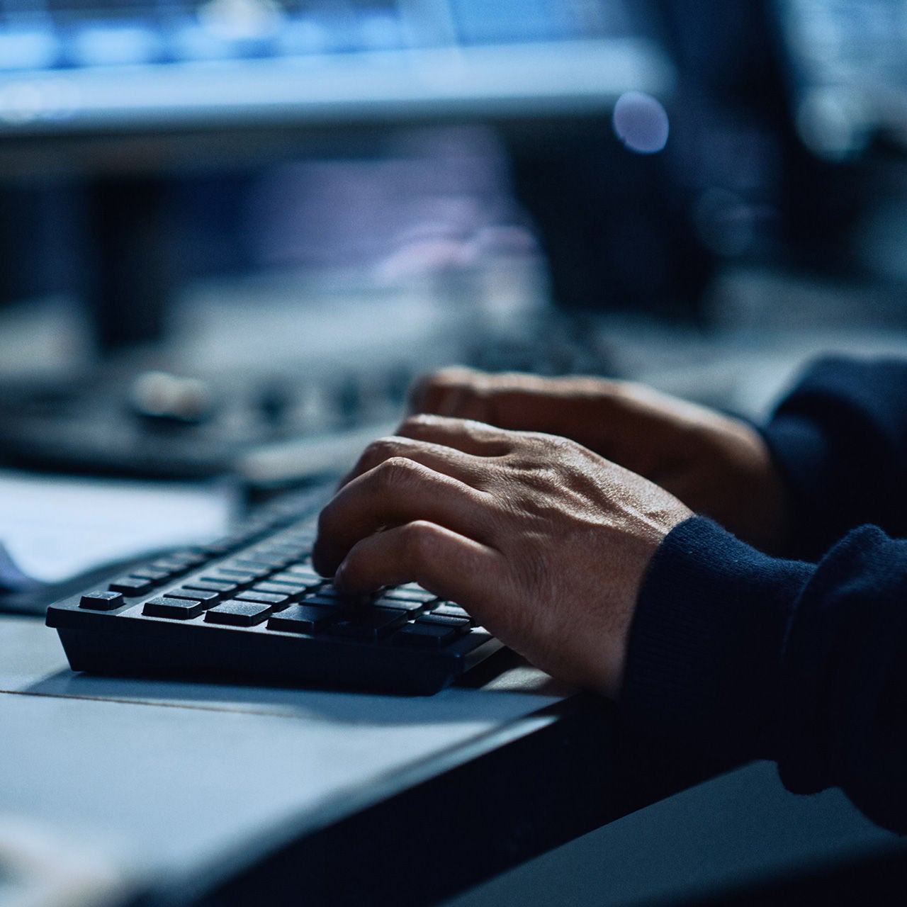 Hands on laptop keyboard