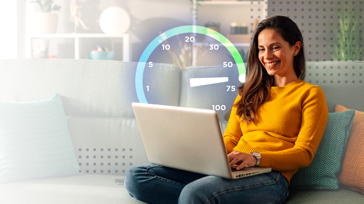 A woman smiling using a laptop with a great subscriber experience