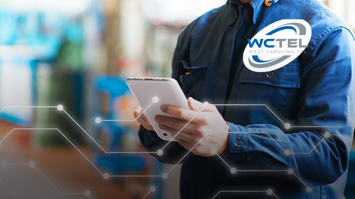 WCTEL logo and technician