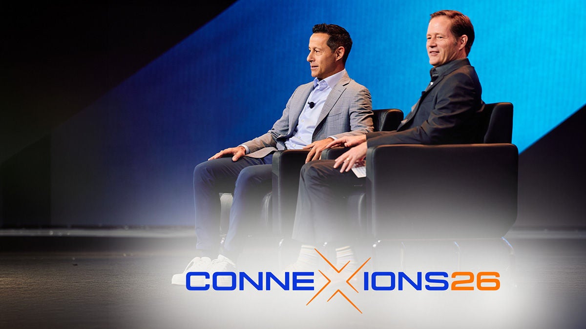 Michael weening and guest on stage at ConneXions event