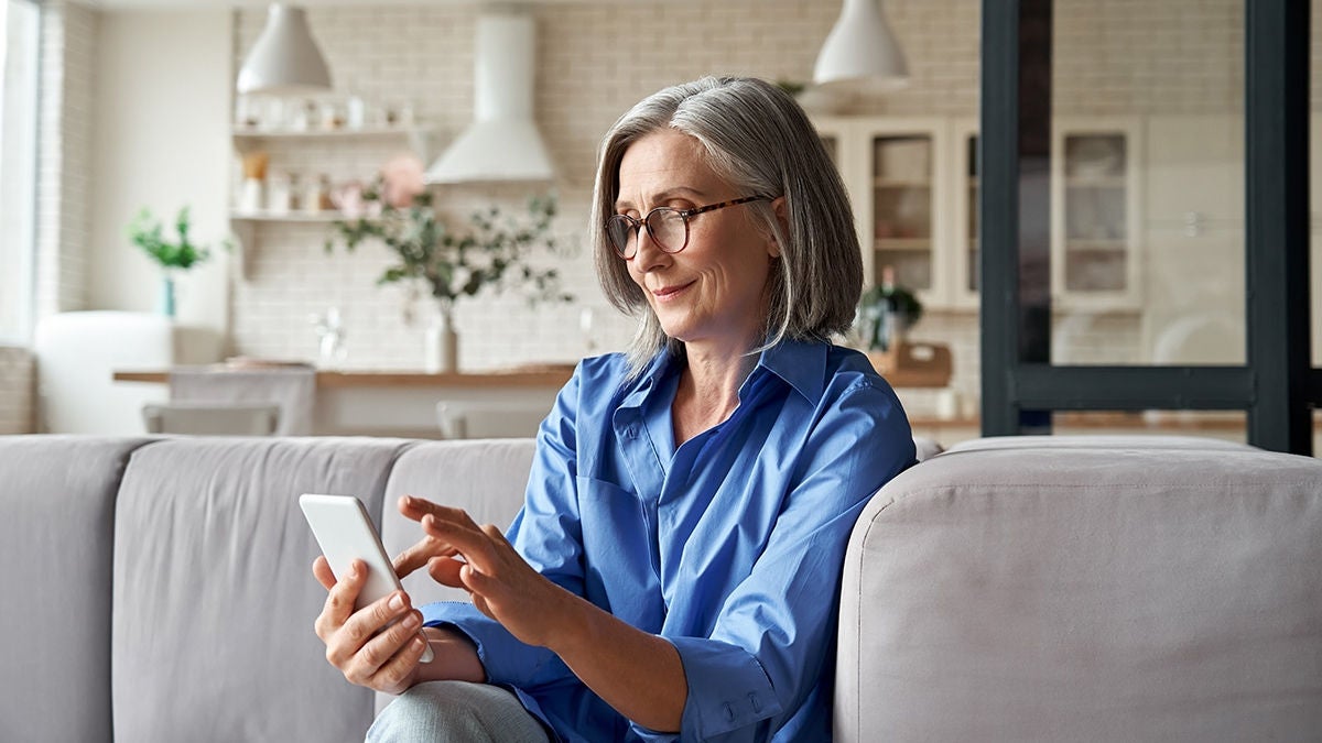 woman at home with phone
