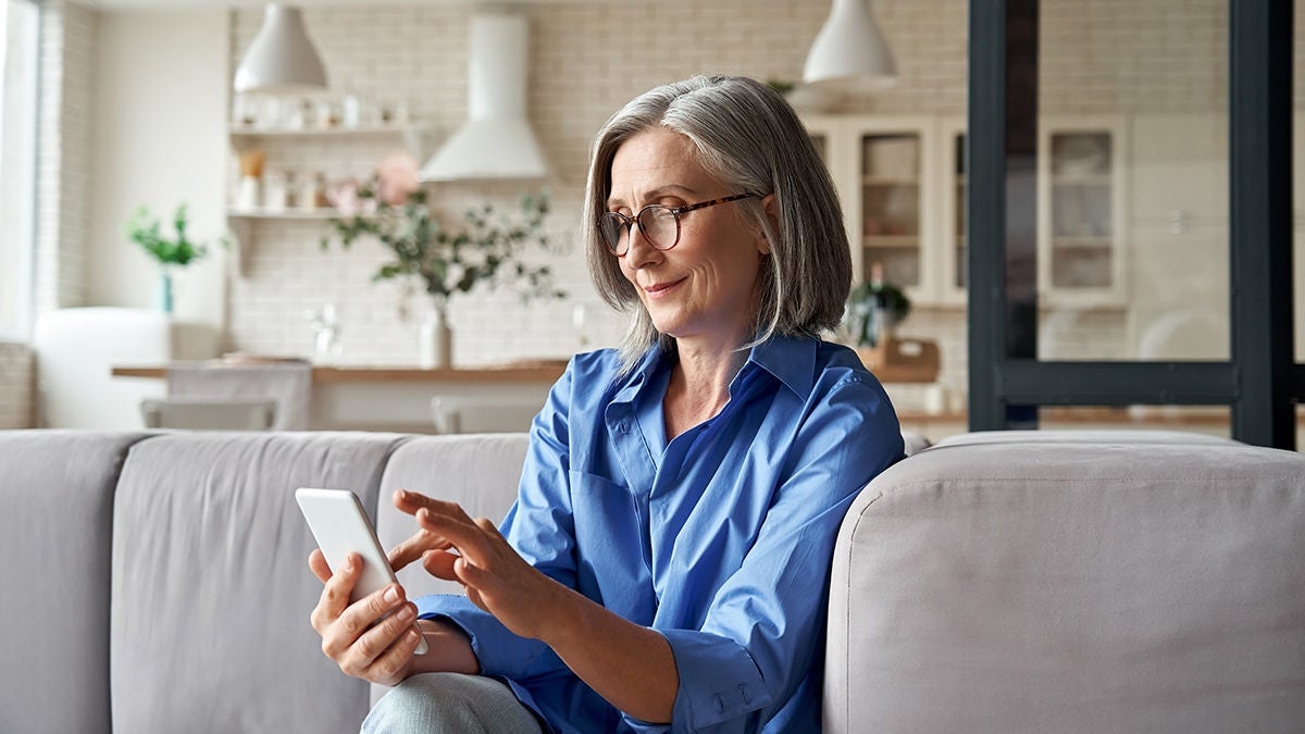 woman at home with phone