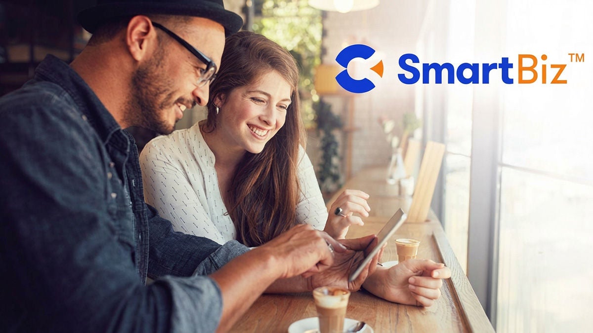 Calix SmartBiz logo over couple in coffeeshop with device