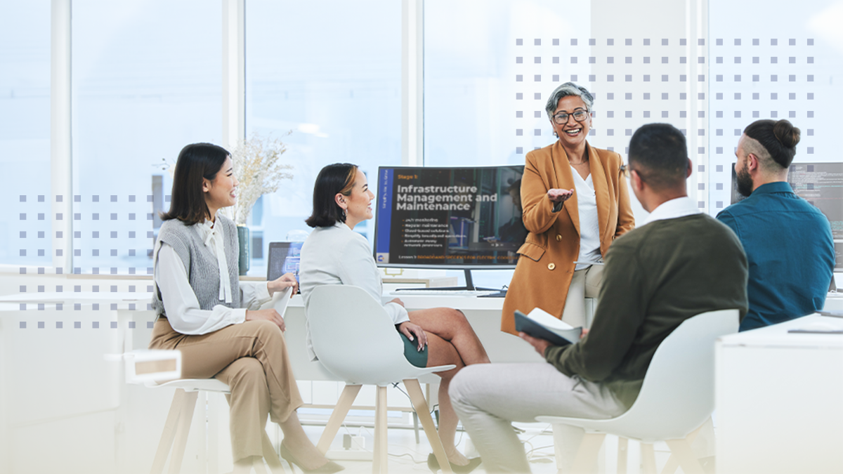 Business people listening to a leader in team meeting