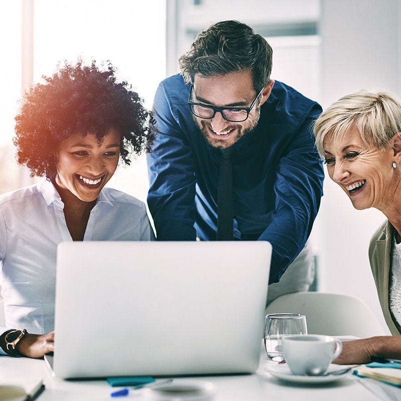 Office employees using Calix Cloud on laptop