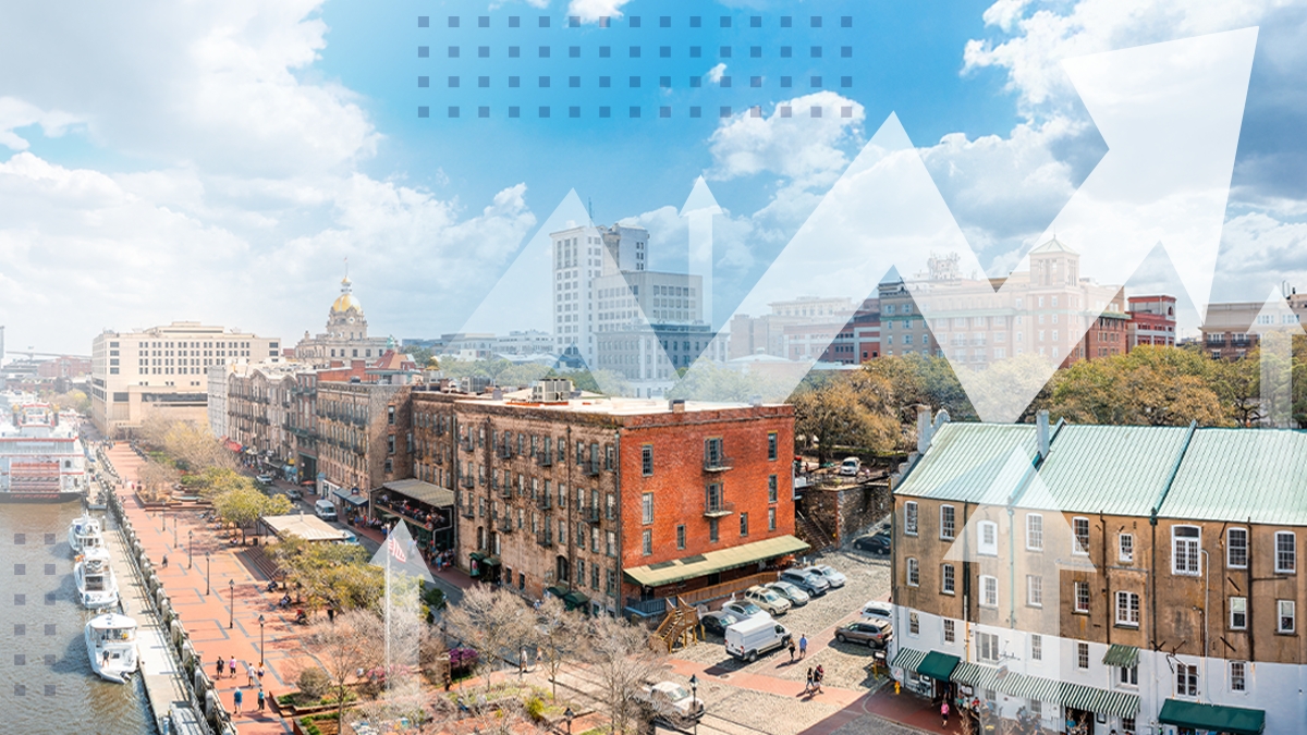 An aerial view of small businesses using SmartBiz services with abstract arrows pointing up overlaid