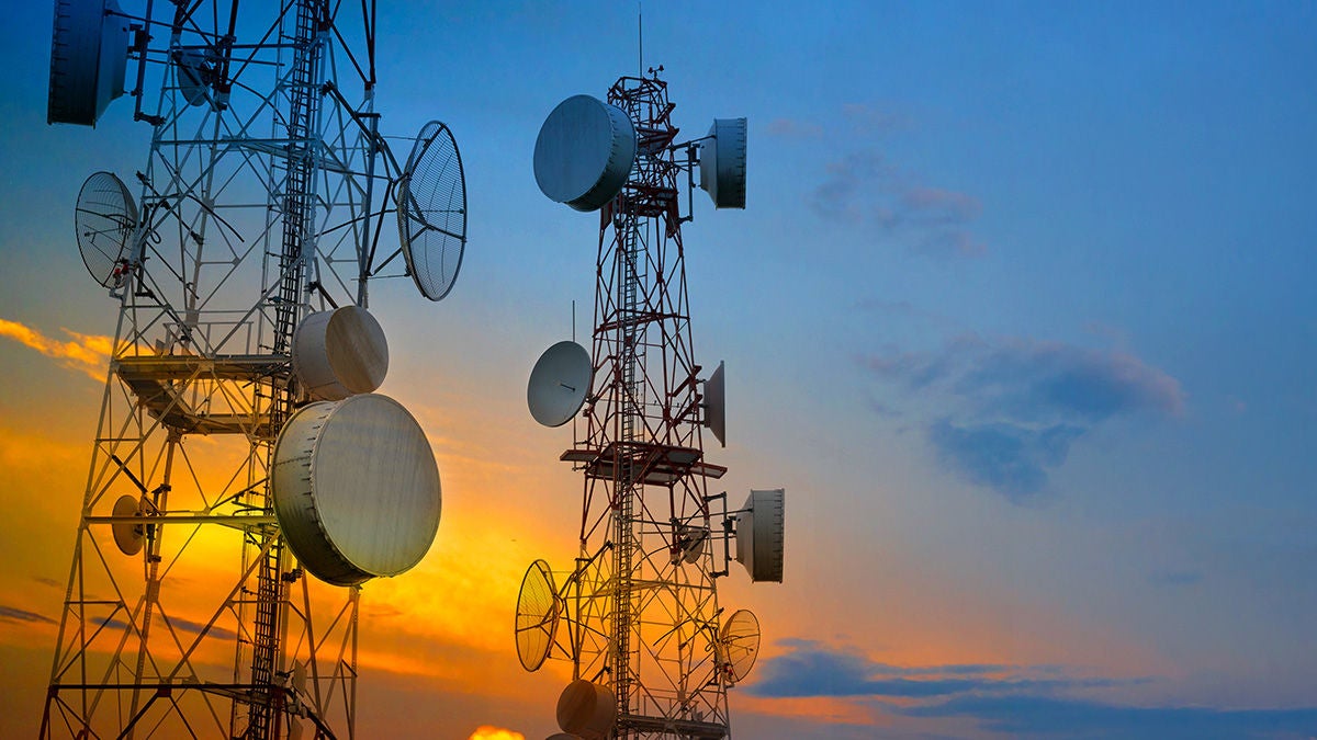 radio towers at sunset